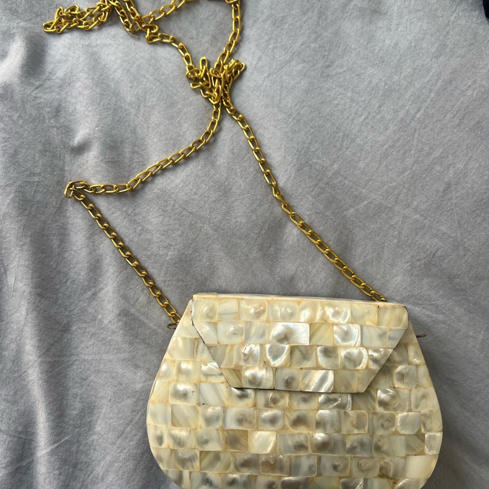 Elegant Cream Shell Clutch with Gold Chain